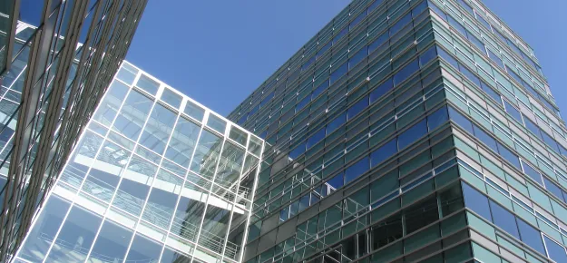 view looking up at glass office building