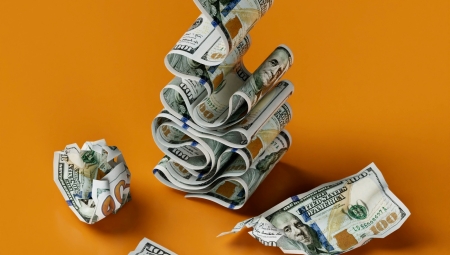 A ribbon of $100 bills implying they are being quickly printed