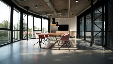 Table and chairs in a modern meeting space.